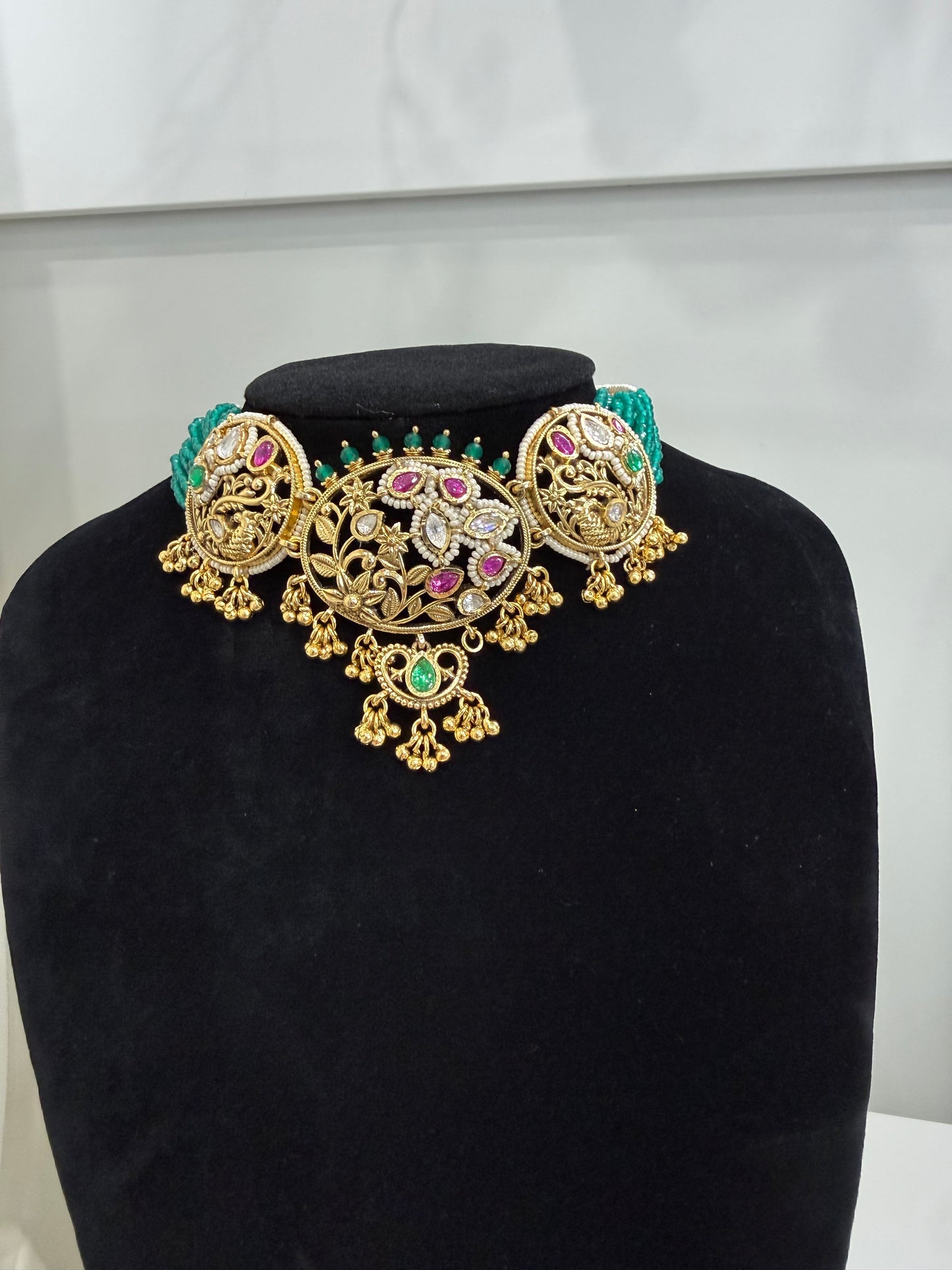Stunning Gold and Kundan Set with Green and Red Stone Work and Pearls